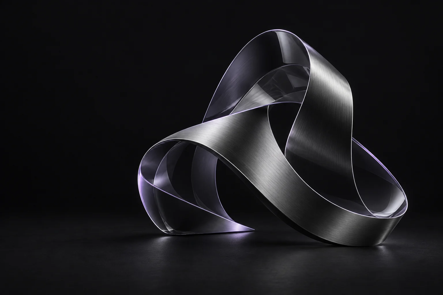 An intertwined graphite and glass ribbon sculpture